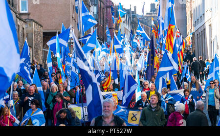 Edinburgh, Scotland, United Kingdom, 7th October 2018. All Under One Banner (AUOB) Scottish March and Rally for Independence. Pro- Scottish independence  supporters walking from Edinburgh Castle to the Scottish Parliament at Holyrood. AOUB is a pro-independence organisation. Credit: Iain Masterton/Alamy Live News Stock Photo