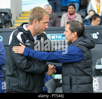 Liberty Stadium, Swansea, UK. 6th Oct, 2018. EFL Championship football, Swansea City versus Ipswich Town; Graham Potter manager of Swansea City and Paul Hurst manager of Ipswich Town shake hands before kick off Credit: Action Plus Sports/Alamy Live News Stock Photo