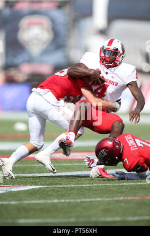 October 6, 2018: New Mexico Lobos quarterback Sheriron Jones (4) is tackled during the NCAA football game featuring the New Mexico Lobos and the UNLV Rebels at Sam Boyd Stadium in Las Vegas, NV. The New Mexico Lobos lead the UNLV Rebels at halftime 29 to 0. Christopher Trim/CSM. Stock Photo