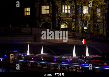 October 6, 2018 - A ship on the river Spree is passing the illuminated Bode-Museum as people are watching during the 14. Festival of Lights in Berlin. Artful displays can be seen on landmarks and buildings across the city through the use of illuminations, luministic projections and 3D mapping. Credit: Jan Scheunert/ZUMA Wire/Alamy Live News Stock Photo