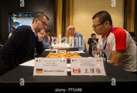 Markham, Canada. 6th Oct, 2018. Players compete during the 3rd World Xiangqi Team Open in Markham, Canada, Oct. 6, 2018. With above 100 players, 22 teams from around the world, this three-day biennial event kicked off on Saturday in Canada. Credit: Zou Zheng/Xinhua/Alamy Live News Stock Photo