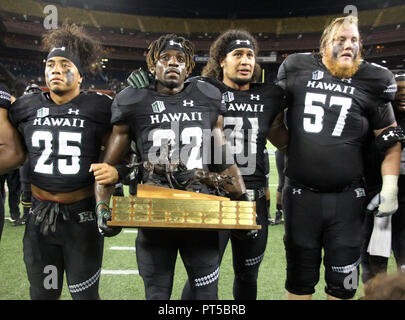 October 6, 2018 - Celebration ensues with the turn over of the Paniolo Trophy after Hawaii won 17-13 in a game between the Hawaii Rainbow Warriors and the Wyoming Cowboys at Aloha Stadium in Honolulu, HI - Michael Sullivan/CSM Stock Photo