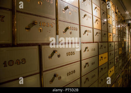 numbered old fashioned secure lockers at old bank building in Den Haag, Holland Stock Photo