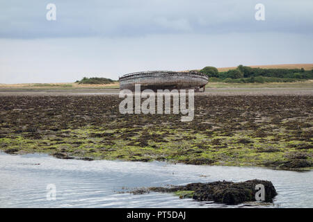 Old Wooden Ship Wreck on the Sands in the Estuary at Traeth Dulas on the Isle of Anglesey Coastal Path, Wales, UK. Stock Photo