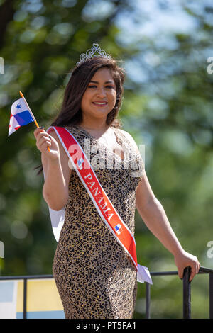 Washington, D.C., USA - September 29, 2018: The Fiesta DC Parade, Panamanian beauty queen Holding the panamanian flag going on top of a float down the