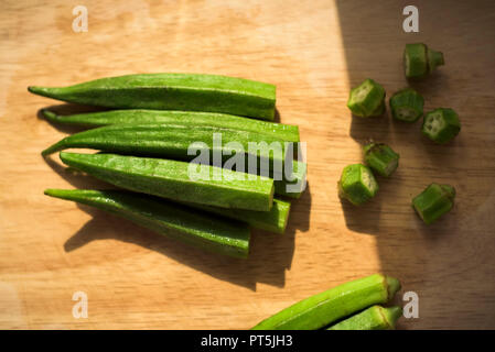 Ladies fingers vegetable on a cutting board top view Stock Photo