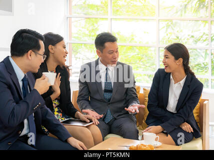 Business people having a conversation in the cafe on coffee time Stock Photo