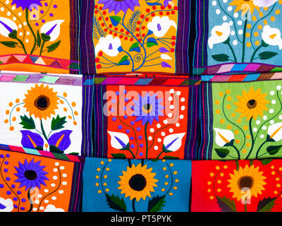 Multicolored ethnic placemats with floral patterns and geometric shapes Stock Photo