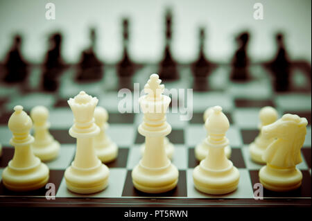 The white pawn chess piece is starting the game on chessboard Stock Photo -  Alamy