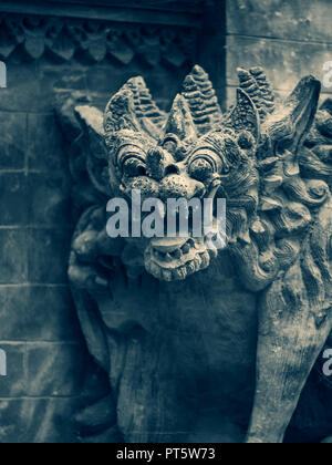 Traditional stone statues depicting demons, gods and Balinese mythological deities in Bali,Indonesia Stock Photo