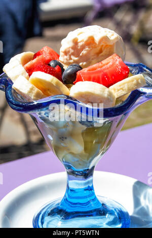 fruit salad and icecream served in a glass cup Stock Photo