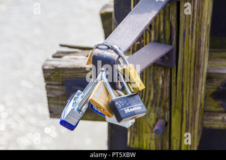 Love locks on Appalachian Trail walkway on railroad bridge over Upper Potomac River in Harpers Ferry National Historical Park in West Virginia Stock Photo