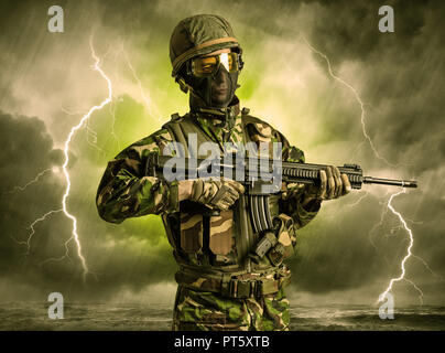 Armed soldier standing in rainy obscure weather  Stock Photo