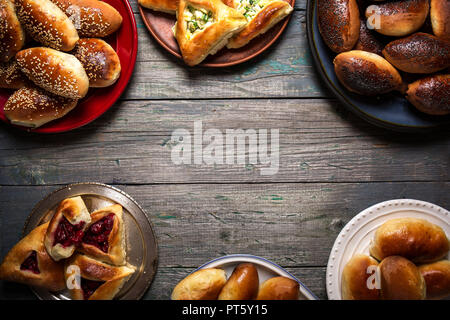 Empty frame of pies on wooden background Stock Photo