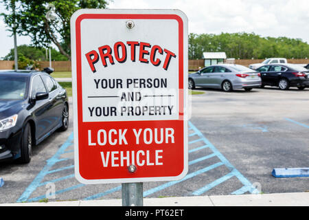 Florida,Everglades,Big Cypress National Preserve,car park parking lot,sign,lock your vehicle protect property,Oasis Visitor Center centre,FL180731023 Stock Photo