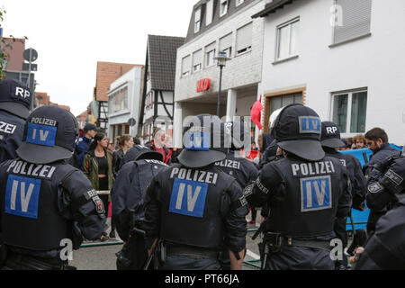 Riot police officers separate the two protests. Around 300 people from right-wing organisations protested for the 14. time in the city of Kandel in Palatinate against refugees, foreigners and the German government. They called for more security of Germans and women from the alleged increased violence by refugees. The place of the protest was chosen because of the 2017 Kandel stabbing attack, in which a 15 year old girl was killed by an asylum seeker. They were confronted by around 400 anti-fascist counter-protesters from different political parties and organisations. (Photo by Michael Debets/P Stock Photo
