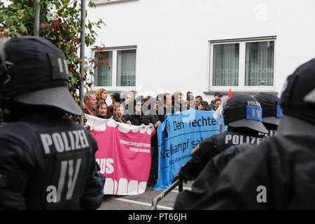 Riot police officers separate the two protests. Around 300 people from right-wing organisations protested for the 14. time in the city of Kandel in Palatinate against refugees, foreigners and the German government. They called for more security of Germans and women from the alleged increased violence by refugees. The place of the protest was chosen because of the 2017 Kandel stabbing attack, in which a 15 year old girl was killed by an asylum seeker. They were confronted by around 400 anti-fascist counter-protesters from different political parties and organisations. (Photo by Michael Debets/P Stock Photo