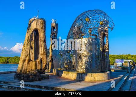 KRABI, THAILAND - MARCH, 2018: Beautiful outdoor view of totems and metallic eagle structures in a park at Krabi town, local people walk relax and exe Stock Photo