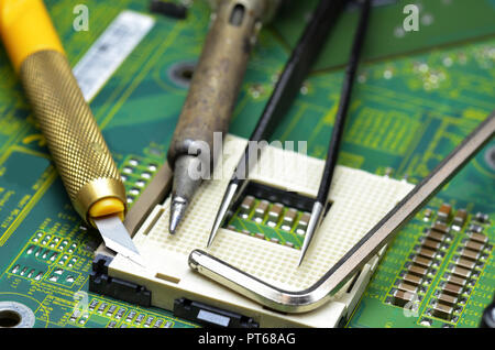 Close up of tools on the motherboard of the laptop Stock Photo