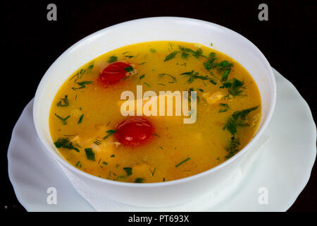 Fish soup with salmon and tomato - Uha Stock Photo