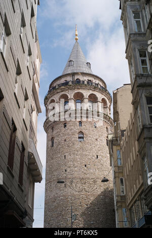 Historic Galata Tower and some adjacent Houses in Istanbul, Turkey Stock Photo