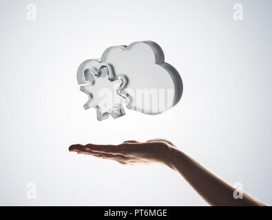Cloud computing concept with glass symbol shown in hand Stock Photo