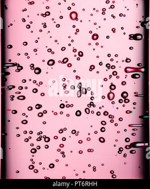 Pink Rose Bubbles Floating in Liquid, Texture, Cosmetics Stock Photo