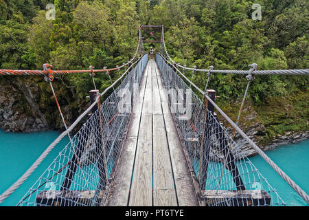 Swing bridge over the Hokitika river gorge, west coast, hiking in New Zealand Stock Photo