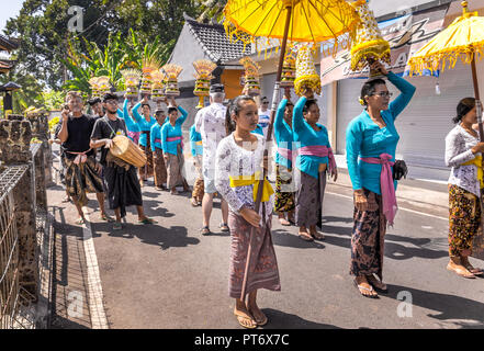 BALI, INDONESIA - APRIL 25, 2018: Balinese street performance, traditional balinese costumes in Ubud District on Bali island, Indonesia Stock Photo