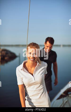 https://l450v.alamy.com/450v/pt6xd2/smiling-young-woman-leading-her-husband-by-the-hand-on-the-deck-of-a-boat-while-enjoying-the-day-sailing-together-pt6xd2.jpg