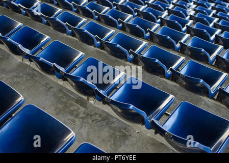 Empty sport stadium plastic chairs in a row Stock Photo