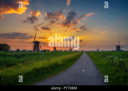 Sunset above old dutch windmills Stock Photo