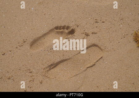 Footprints on the sand at a Beach on a Caribbean island Stock Photo
