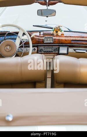 the interior of the Mercedes oldtimer in a beige and white color, covered with leather and wood, Pforzheim, Germany, 07.10.2018 Stock Photo