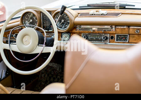 the interior of the Mercedes oldtimer in a beige and white color, covered with leather and wood, Pforzheim, Germany, 07.10.2018 Stock Photo