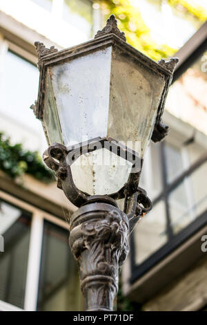 An old glass street lamp on the background of a building in a small German town Stock Photo