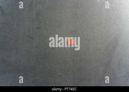 Hamburg , Germany, June 26, 2018:Full Frame Close-Up of Gray Metal Wall with Small Piece of Red Tape Stock Photo