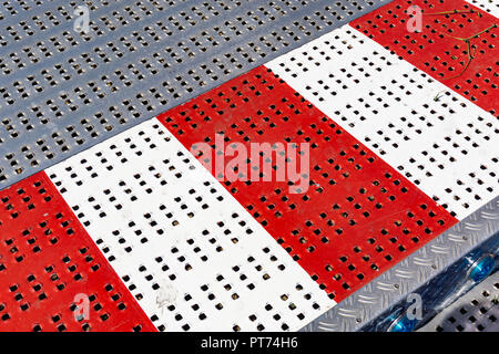 Berlin, Germany, August 16, 2018: Full Frame Close-Up of Red White Striped Metal Flooring Stock Photo