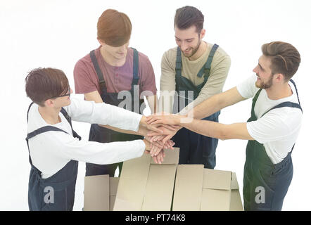 Young movers holding boxes. Delivering and transportation concept. Stock Photo