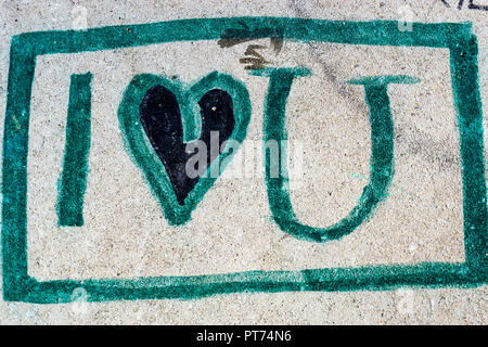 Berlin, Germany, October 06, 2018:  Close-Up of 'I Love U' Graffiti on Stone Bench Stock Photo