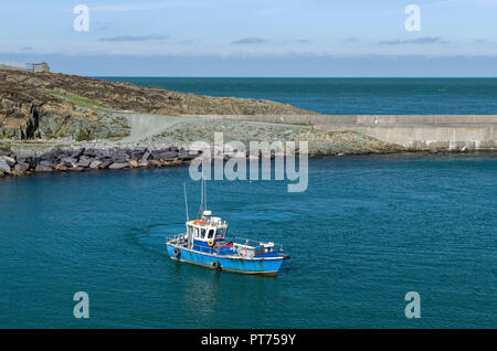 Fishing Boat coming into Amlwch Harbour Anglesey, North Wales Stock Photo