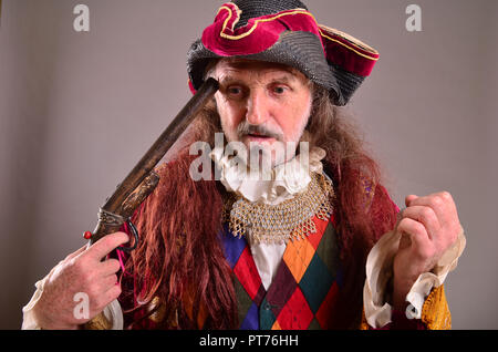 Hopeless situation, old pirate thinks to commit suicide Stock Photo