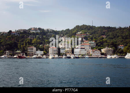 View of motorboats and yachts, buildings on European side and Bosphorus in Istanbul. It is a sunny summer day. Stock Photo