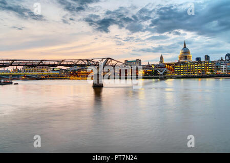 The Millennium Bridge and St. Paul's cathedral in London, UK, just after sunset Stock Photo