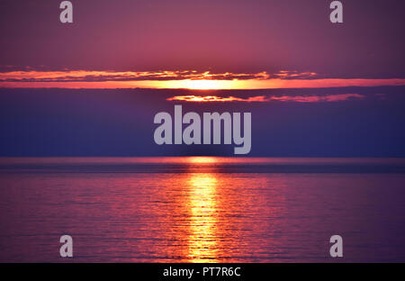 Bright sunrise over the Baltic sea in Gdynia, Poland Stock Photo
