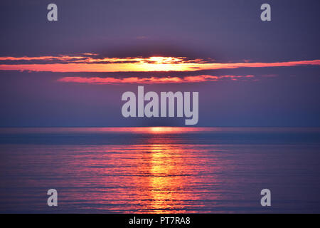 Bright sunrise over the Baltic sea in Gdynia, Poland Stock Photo