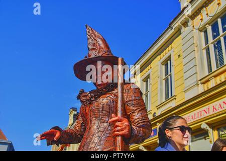 HUSTOPECE, CZECH REPUBLIC - OCTOBER 7, 2018: Living statue of witch. Live statue of sorceress. Living statue street performer. Living statue performer Stock Photo