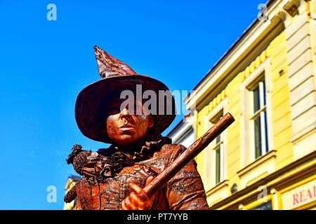 HUSTOPECE, CZECH REPUBLIC - OCTOBER 7, 2018: Living statue of witch. Live statue of sorceress. Living statue street performer. Stock Photo