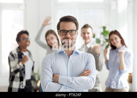 Confident businessman with group of multiracial business people  Stock Photo