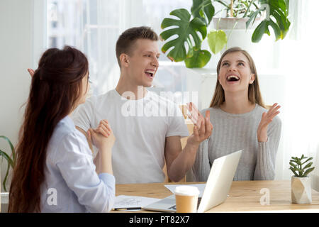 Happy family at real estate agency office Stock Photo